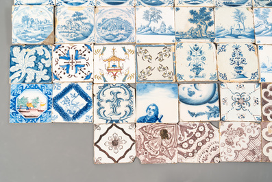 A collection of 54 blue, white, manganese and polychrome Dutch Delft tiles, 17/18th C