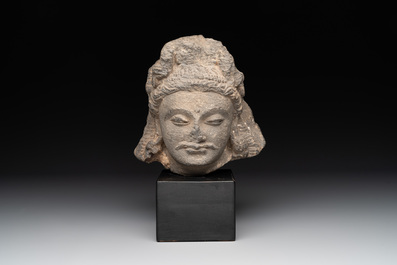 A Gandhara grey schist relief fragment of a Bodhisattva head, 2nd/3rd C.