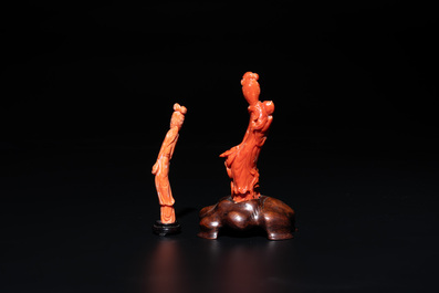 Two Chinese red coral sculptures of ladies on wooden stand, 19/20th C.
