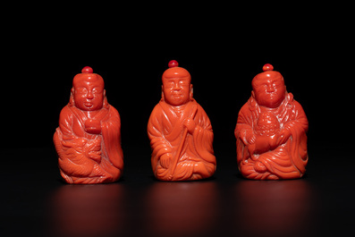 A set of ten Chinese coral-red glass Luohan-form snuff bottles, 20th C.
