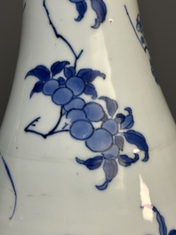 A Chinese blue and white pear-shaped vase with floral design, Transitional period