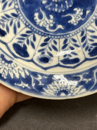 A Chinese blue and white reticulated double-walled cup and saucer, fu mark, Kangxi