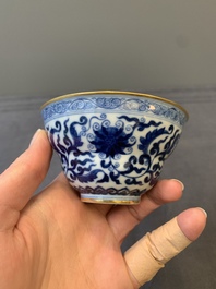 A Chinese gilt-decorated blue and white 'lotus scroll' bowl, Daoguang mark and of the period