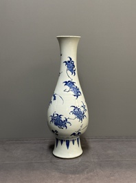 A Chinese blue and white pear-shaped vase with floral design, Transitional period