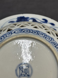 A Chinese blue and white reticulated double-walled cup and saucer, fu mark, Kangxi