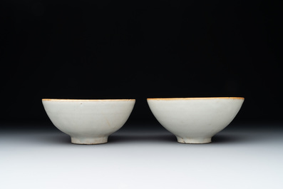 Four Chinese white-glazed saucers and three bowls, Yuan/Ming