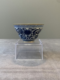A Chinese gilt-decorated blue and white 'lotus scroll' bowl, Daoguang mark and of the period
