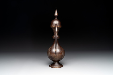 A Persian steel engraved gilt-decorated pear-shaped ewer and cover with floral design, Qajar, 19th C.