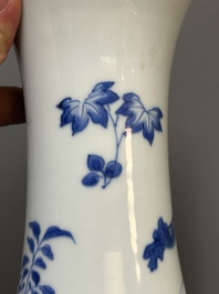 A Chinese blue and white pear-shaped vase with floral design, Transitional period
