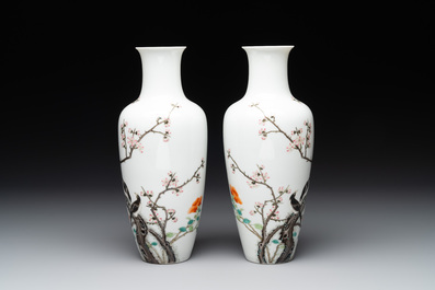 A pair of Chinese famille rose 'birds among flowering branches' vases, Ju Ren Tang 居仁堂製 mark, Republic