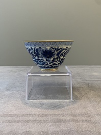 A Chinese gilt-decorated blue and white 'lotus scroll' bowl, Daoguang mark and of the period