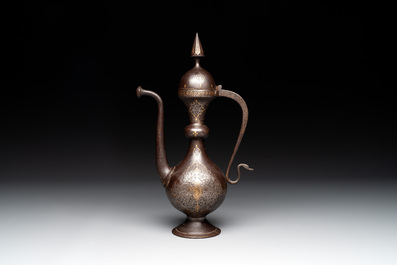 A Persian steel engraved gilt-decorated pear-shaped ewer and cover with floral design, Qajar, 19th C.