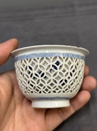 A Chinese blue and white reticulated double-walled cup and saucer, fu mark, Kangxi