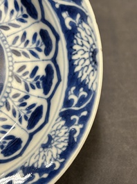 A Chinese blue and white reticulated double-walled cup and saucer, fu mark, Kangxi