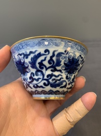 A Chinese gilt-decorated blue and white 'lotus scroll' bowl, Daoguang mark and of the period