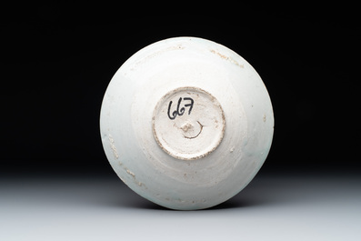 Four Chinese white-glazed saucers and three bowls, Yuan/Ming