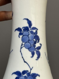 A Chinese blue and white pear-shaped vase with floral design, Transitional period