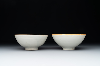 Four Chinese white-glazed saucers and three bowls, Yuan/Ming
