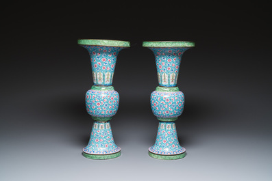 A pair of Chinese Canton enamel 'gu' vases with floral design, Qianlong