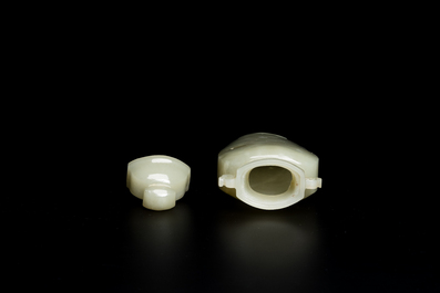 A Chinese white and russet jade lotus-form brush washer and two covered vases, Qing
