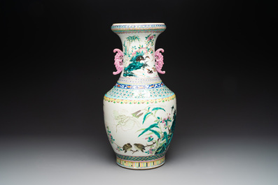 A Chinese famille rose 'magpies and plum blossoms' vase on wooden stand, 19th C.