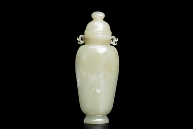 A Chinese white and russet jade lotus-form brush washer and two covered vases, Qing