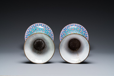 A pair of Chinese Canton enamel 'gu' vases with floral design, Qianlong