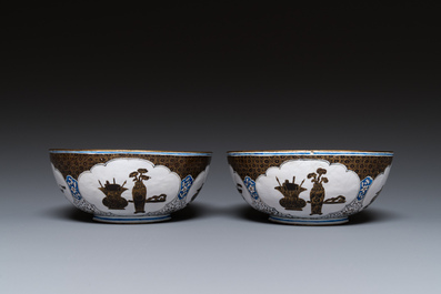 A pair of Chinese Canton enamel 'antiquities' bowls, Yongzheng/Qianlong