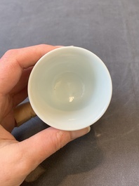 A Chinese white-glazed biscuit 'dragon' cup, Kangxi mark, 19th C.