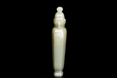 A Chinese white and russet jade lotus-form brush washer and two covered vases, Qing
