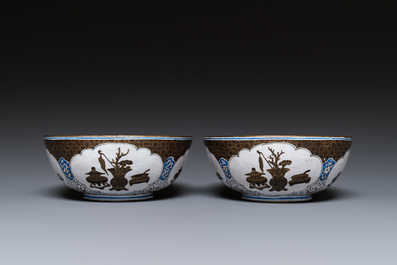 A pair of Chinese Canton enamel 'antiquities' bowls, Yongzheng/Qianlong