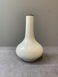 A Chinese white-glazed bottle vase, Gu Jin 古今 mark, 19th C.