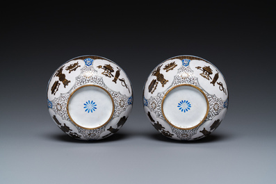 A pair of Chinese Canton enamel 'antiquities' bowls, Yongzheng/Qianlong