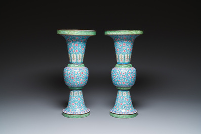 A pair of Chinese Canton enamel 'gu' vases with floral design, Qianlong