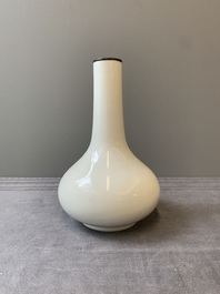 A Chinese white-glazed bottle vase, Gu Jin 古今 mark, 19th C.