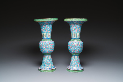 A pair of Chinese Canton enamel 'gu' vases with floral design, Qianlong