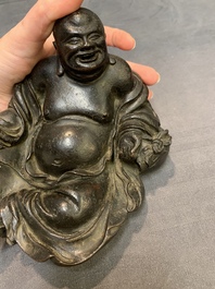 A Chinese bronze Budai, 17th C.
