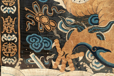 A Chinese embroidered silk tapestry with a five-clawed dragon among clouds and bajixiang, 18/19th C.