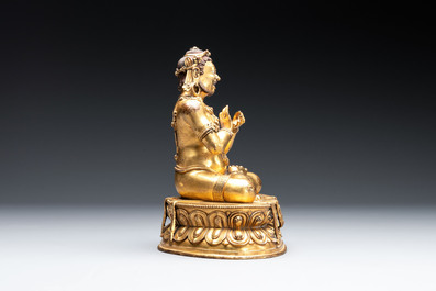 A Sino-Tibetan gilt bronze Virūpa, 19th C.