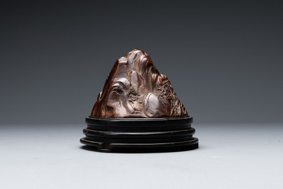 A Chinese agarwood carving of a mountain on wooden stand, 18/19th C.