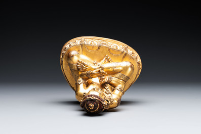 A Sino-Tibetan gilt bronze Virūpa, 19th C.