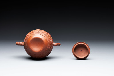 A Chinese Yixing stoneware teapot with boys among flower scrolls, Kangxi