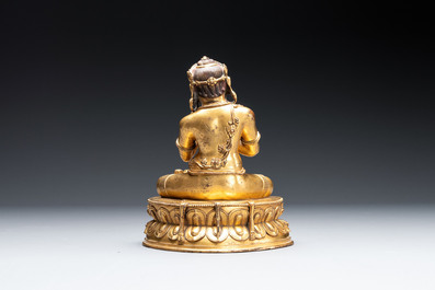 A Sino-Tibetan gilt bronze Virūpa, 19th C.