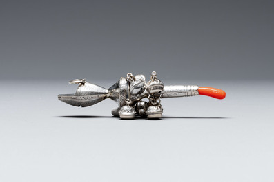 Two silver bottle stoppers, a tobacco box and a baby rattle with red coral teether, Germany, 19/20th C.