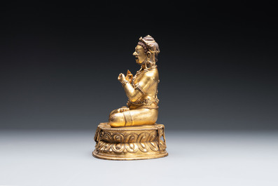 A Sino-Tibetan gilt bronze Virūpa, 19th C.