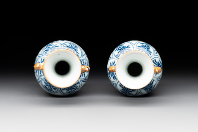 A Chinese blue and white garniture with five vases, Kangxi