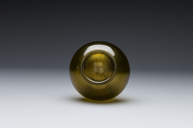 A rare Chinese translucent green Peking glass bottle vase, Qianlong mark and of the period