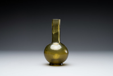 A rare Chinese translucent green Peking glass bottle vase, Qianlong mark and of the period