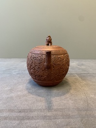 A Chinese Yixing stoneware teapot with boys among flower scrolls, Kangxi