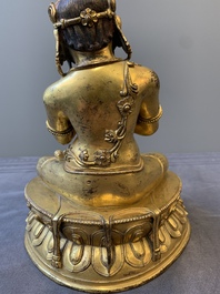 A Sino-Tibetan gilt bronze Virūpa, 19th C.